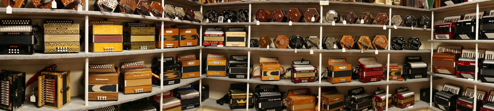 Shelves of button accordions, concertinas and piano accordions